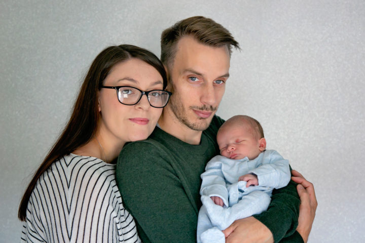 Parents holding their new baby